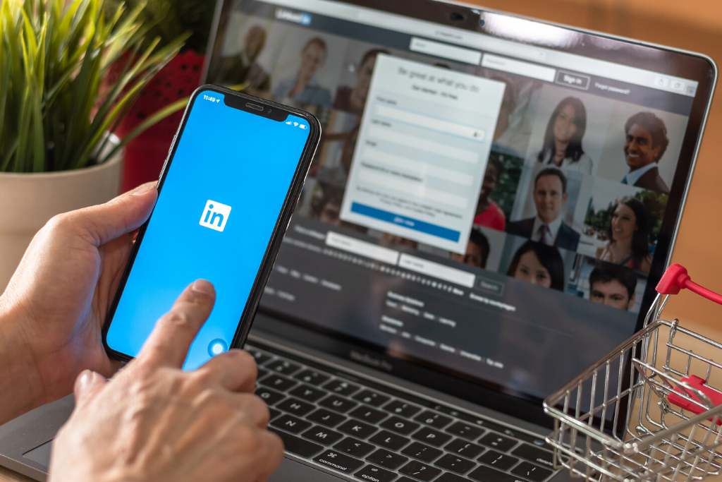 image of LinkedIn on a phone and laptop