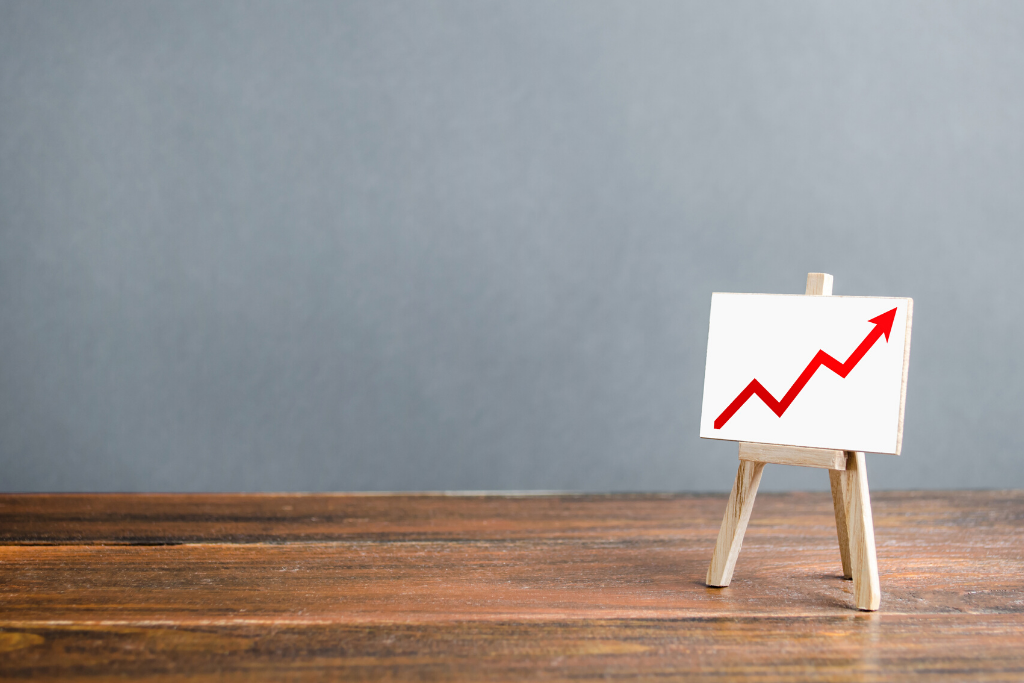 Benchmarking Your Facebook Account image of a canvas on a stand with a red arrow pointing up